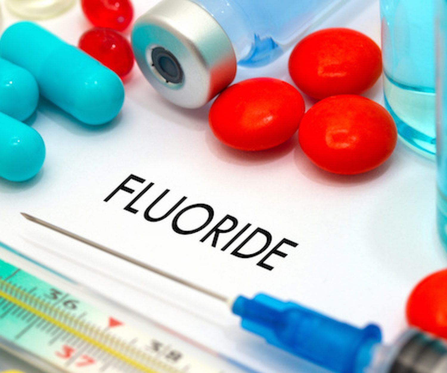 Fluoride. Treatment and prevention of disease. Syringe and vaccine. Medical concept. Selective focus